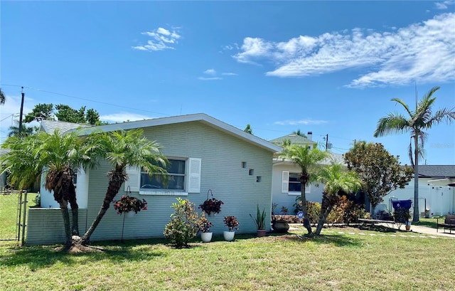 6951 S Shore Dr S, South Pasadena, FL 33707 - exterior space with fence and a lawn