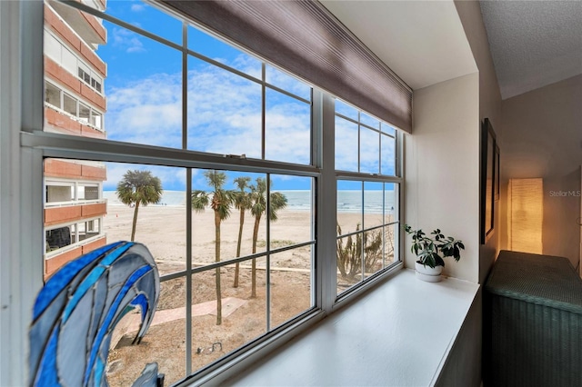 details with a water view and a beach view