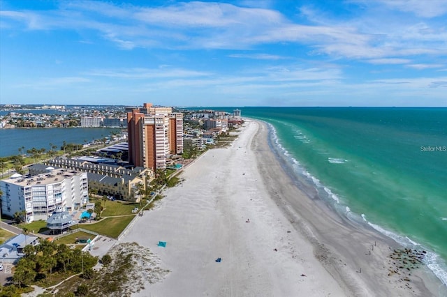 birds eye view of property featuring a view of the beach and a water view