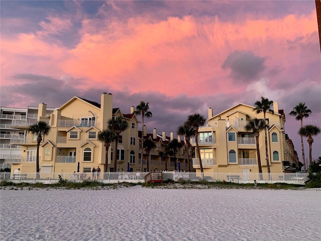 view of outdoor building at dusk