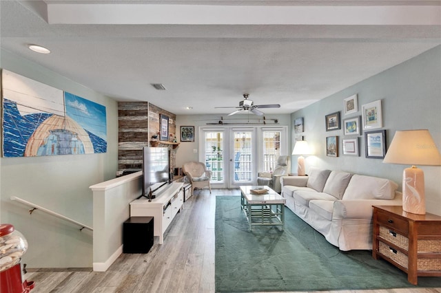 living area with visible vents, recessed lighting, ceiling fan, and wood finished floors