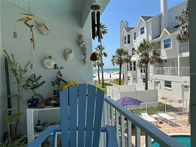 balcony with a view of the beach and a water view