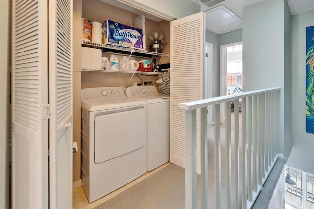 laundry room with laundry area, washing machine and dryer, and visible vents