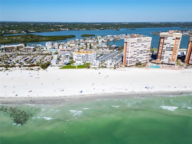 drone / aerial view featuring a water view and a beach view