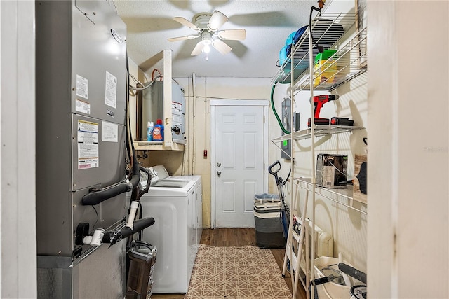 washroom with a ceiling fan, washer and dryer, laundry area, and heating unit