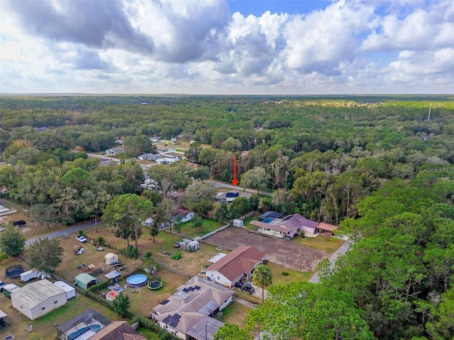 aerial view featuring a residential view and a view of trees