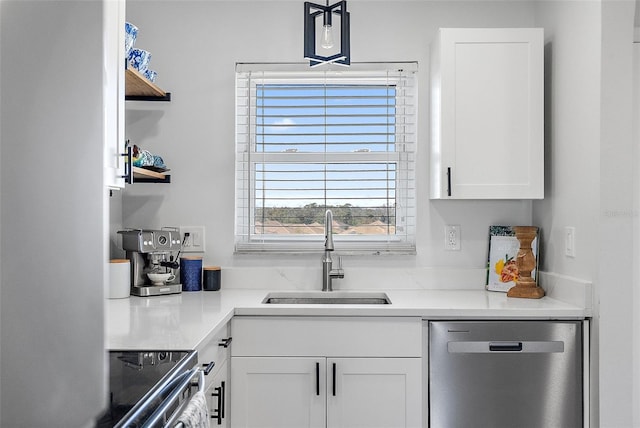 kitchen with white cabinetry, sink, and appliances with stainless steel finishes