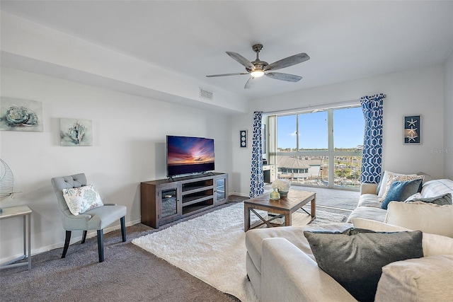 carpeted living room featuring ceiling fan