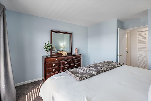 bedroom featuring dark colored carpet