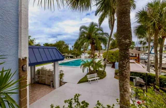 view of swimming pool featuring a patio area