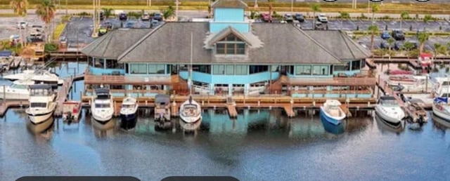 birds eye view of property with a water view