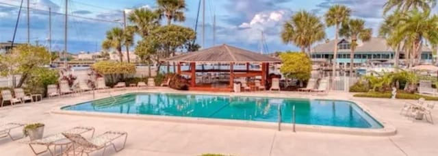 view of swimming pool featuring a gazebo and a patio