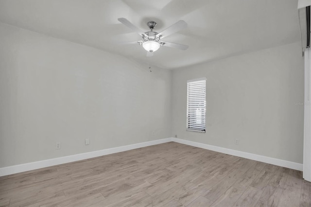 unfurnished room featuring light hardwood / wood-style flooring and ceiling fan