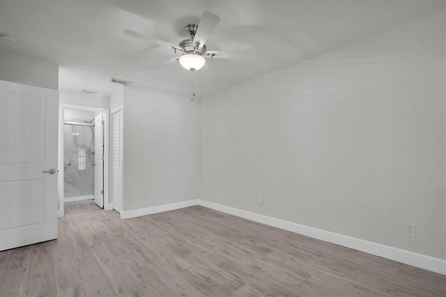 spare room with ceiling fan and light hardwood / wood-style floors