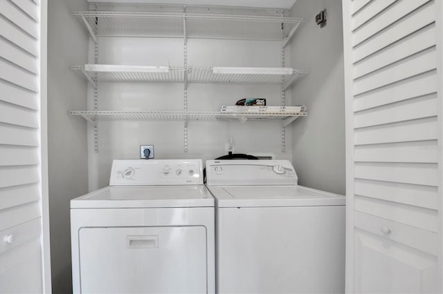 washroom with washing machine and dryer