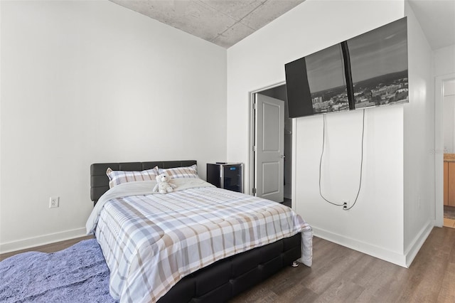 bedroom featuring hardwood / wood-style floors