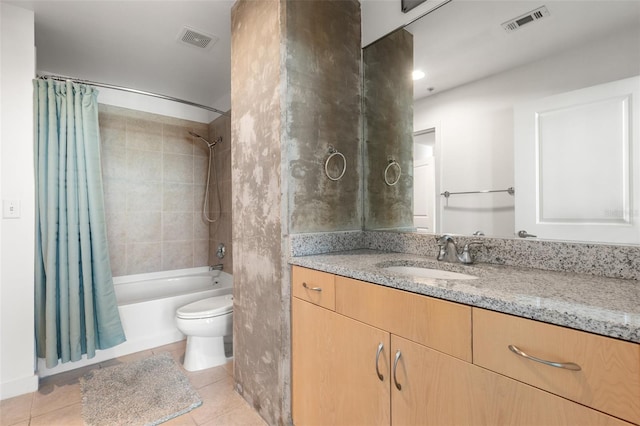 full bathroom featuring tile patterned flooring, vanity, shower / tub combo, and toilet