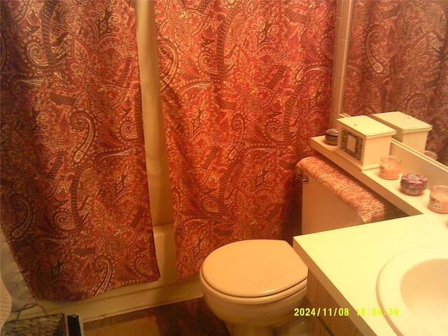 full bathroom featuring vanity, toilet, and shower / bathtub combination with curtain