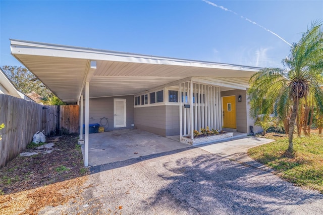 view of front facade with a carport