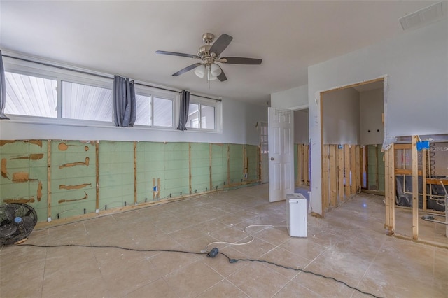 basement featuring ceiling fan