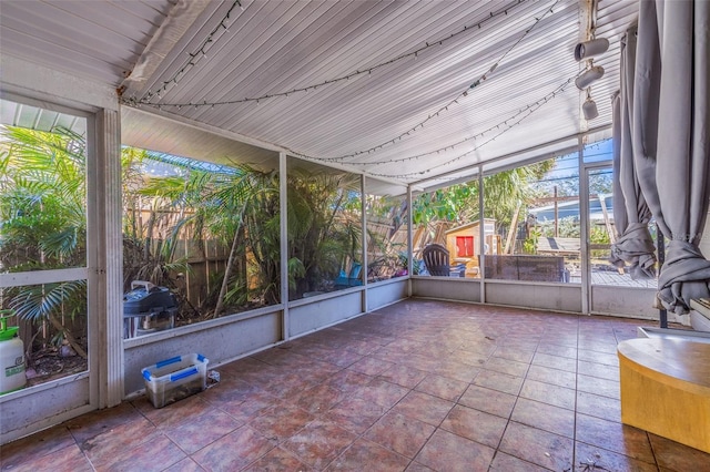 unfurnished sunroom featuring a healthy amount of sunlight