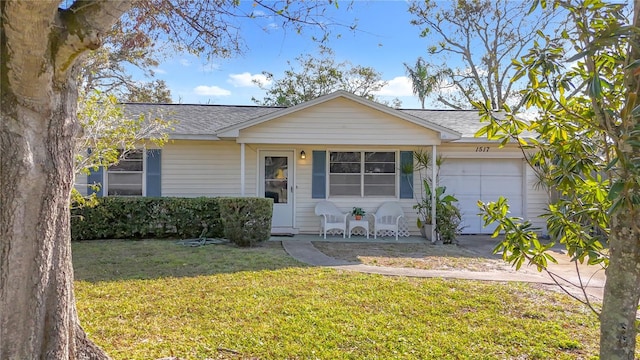 ranch-style home with a garage and a front lawn