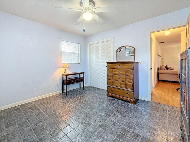 interior space featuring ceiling fan