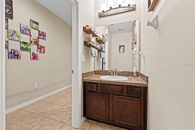 bathroom with tile patterned flooring and vanity