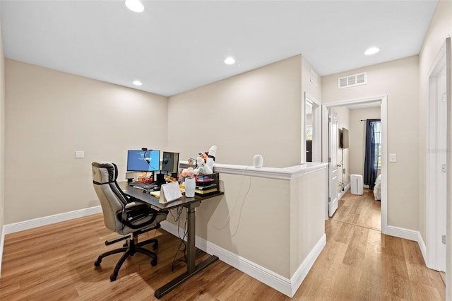 home office featuring light hardwood / wood-style floors