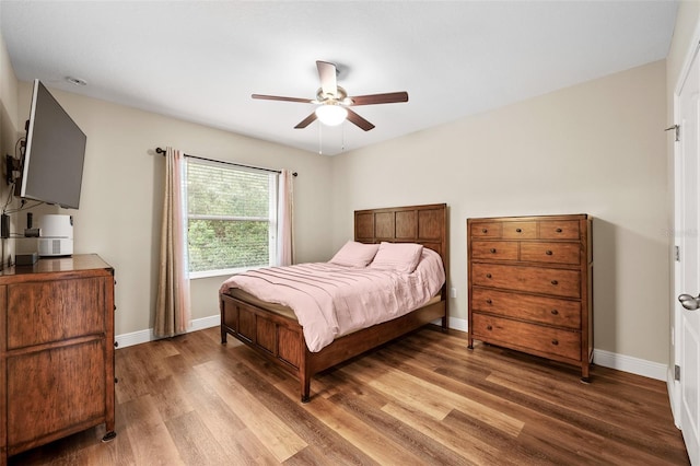 bedroom featuring ceiling fan and wood-type flooring