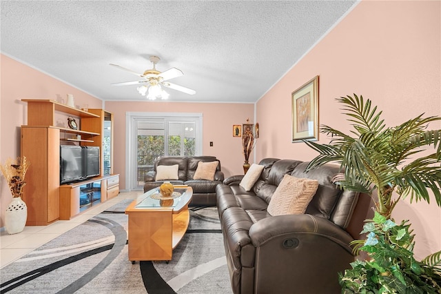 tiled living room featuring ceiling fan and a textured ceiling