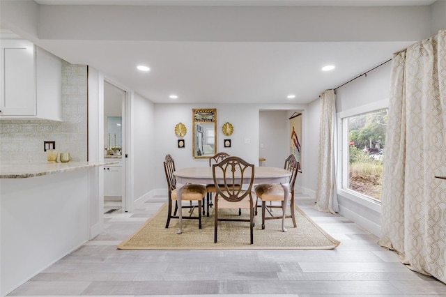 dining room with light hardwood / wood-style floors