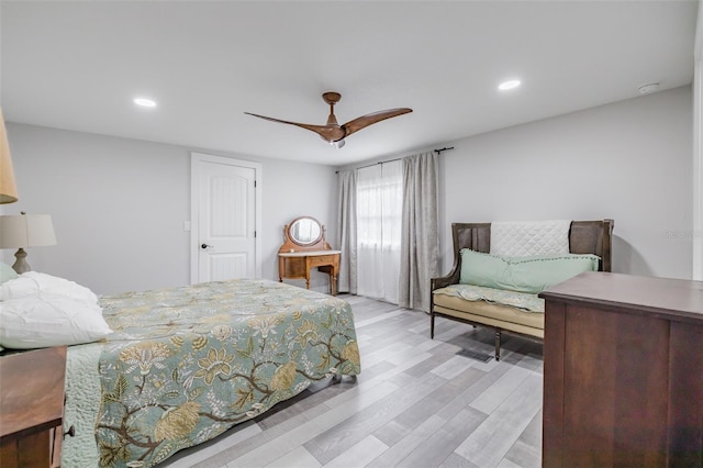 bedroom with light hardwood / wood-style flooring and ceiling fan