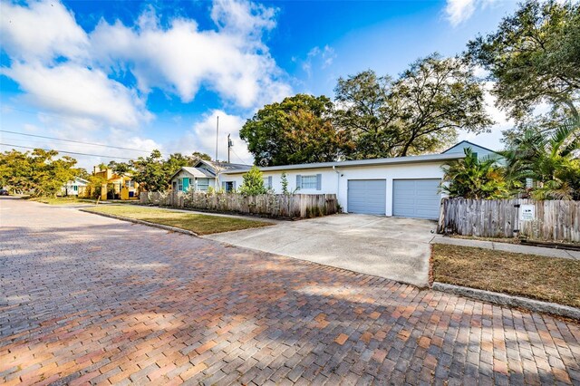 single story home with a garage