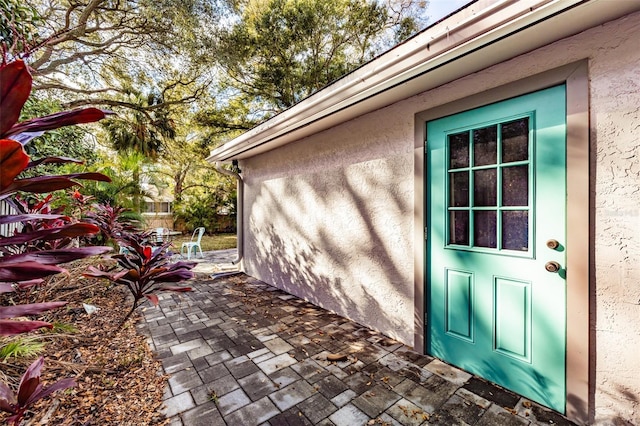 doorway to property featuring a patio area