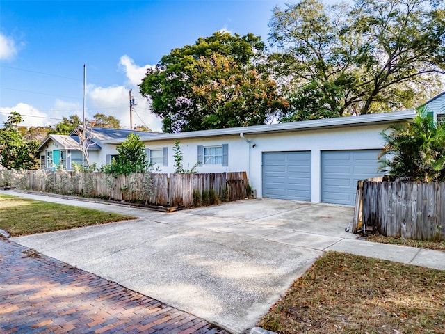 ranch-style house featuring a garage