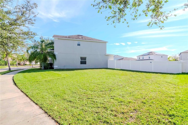 view of home's exterior featuring a lawn