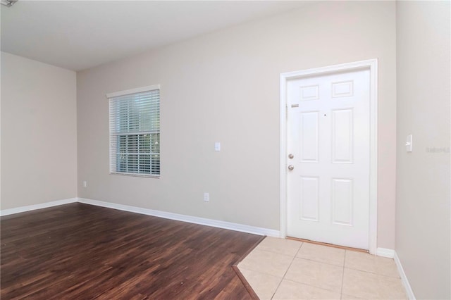 entryway with light tile patterned flooring