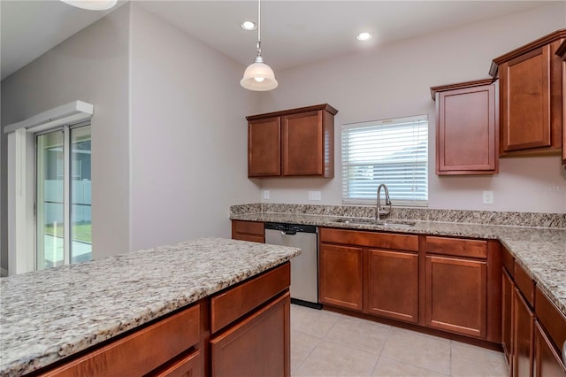 kitchen with pendant lighting, sink, stainless steel dishwasher, light stone countertops, and light tile patterned flooring