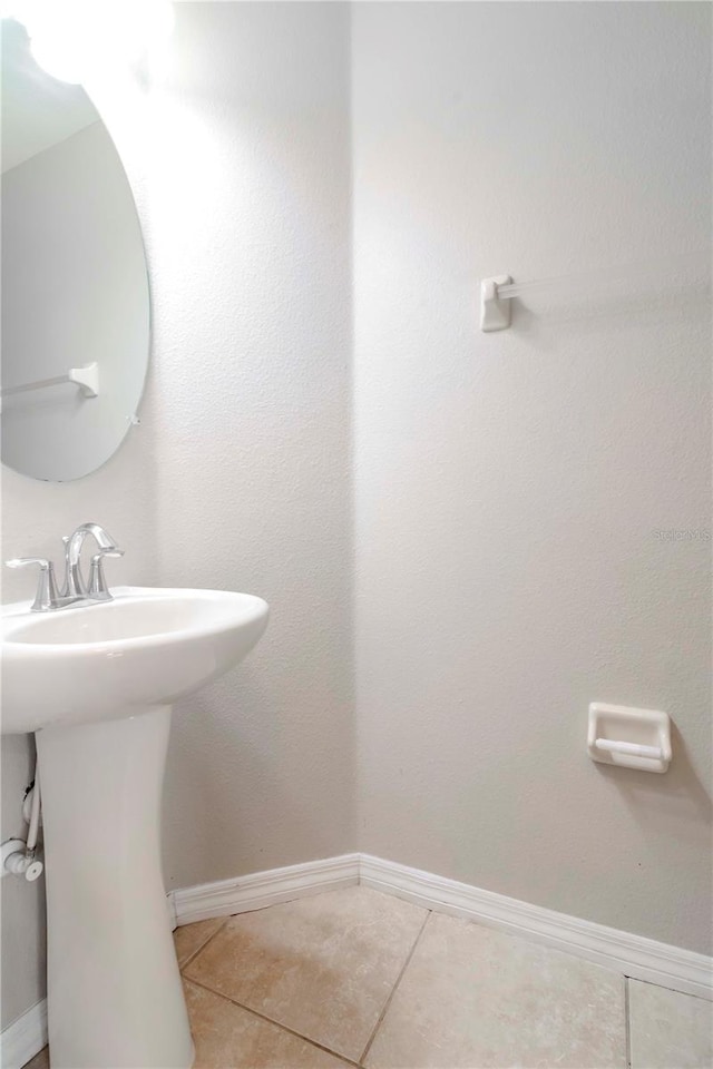 bathroom featuring tile patterned flooring and sink