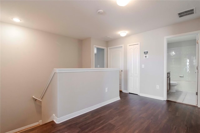 spare room featuring dark hardwood / wood-style floors