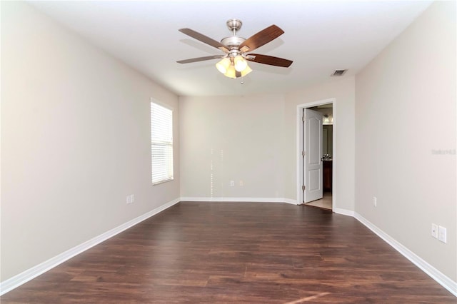 empty room featuring ceiling fan and dark hardwood / wood-style floors