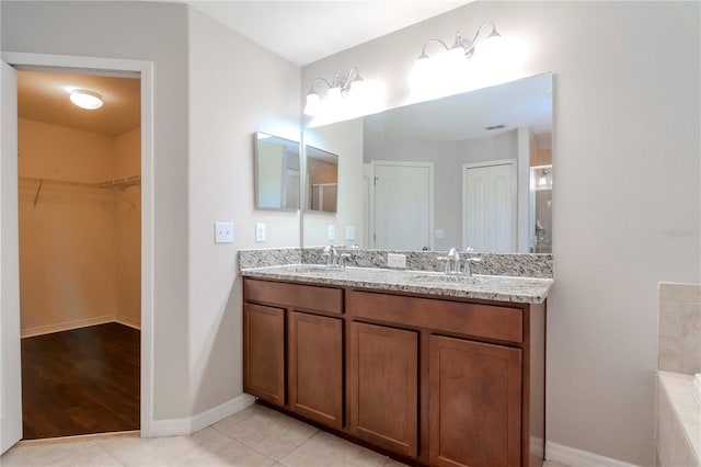 bathroom with vanity and tile patterned floors