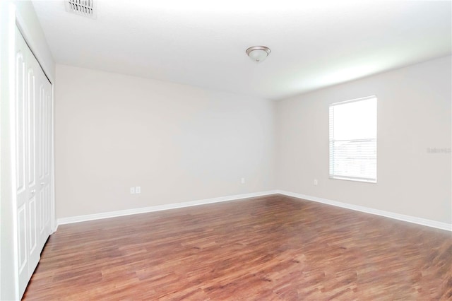 empty room featuring hardwood / wood-style flooring