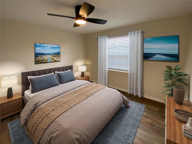 bedroom featuring ceiling fan and dark hardwood / wood-style floors