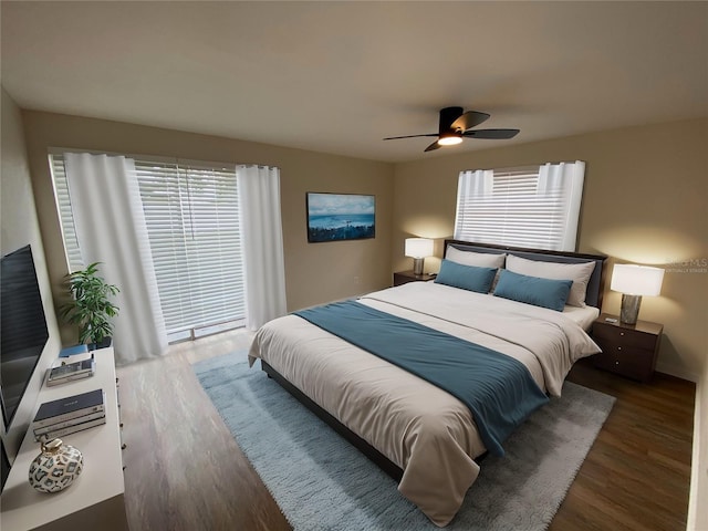 bedroom with ceiling fan and dark hardwood / wood-style floors