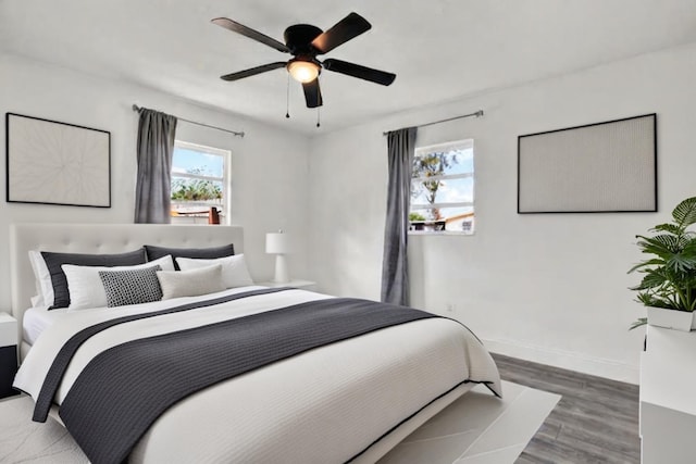 bedroom featuring hardwood / wood-style flooring and ceiling fan