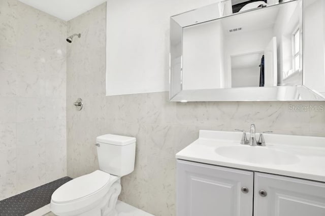 bathroom with vanity, toilet, and walk in shower