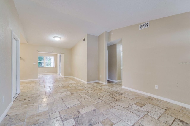 empty room with a textured ceiling