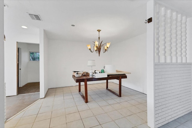 interior space featuring a notable chandelier and light tile patterned floors